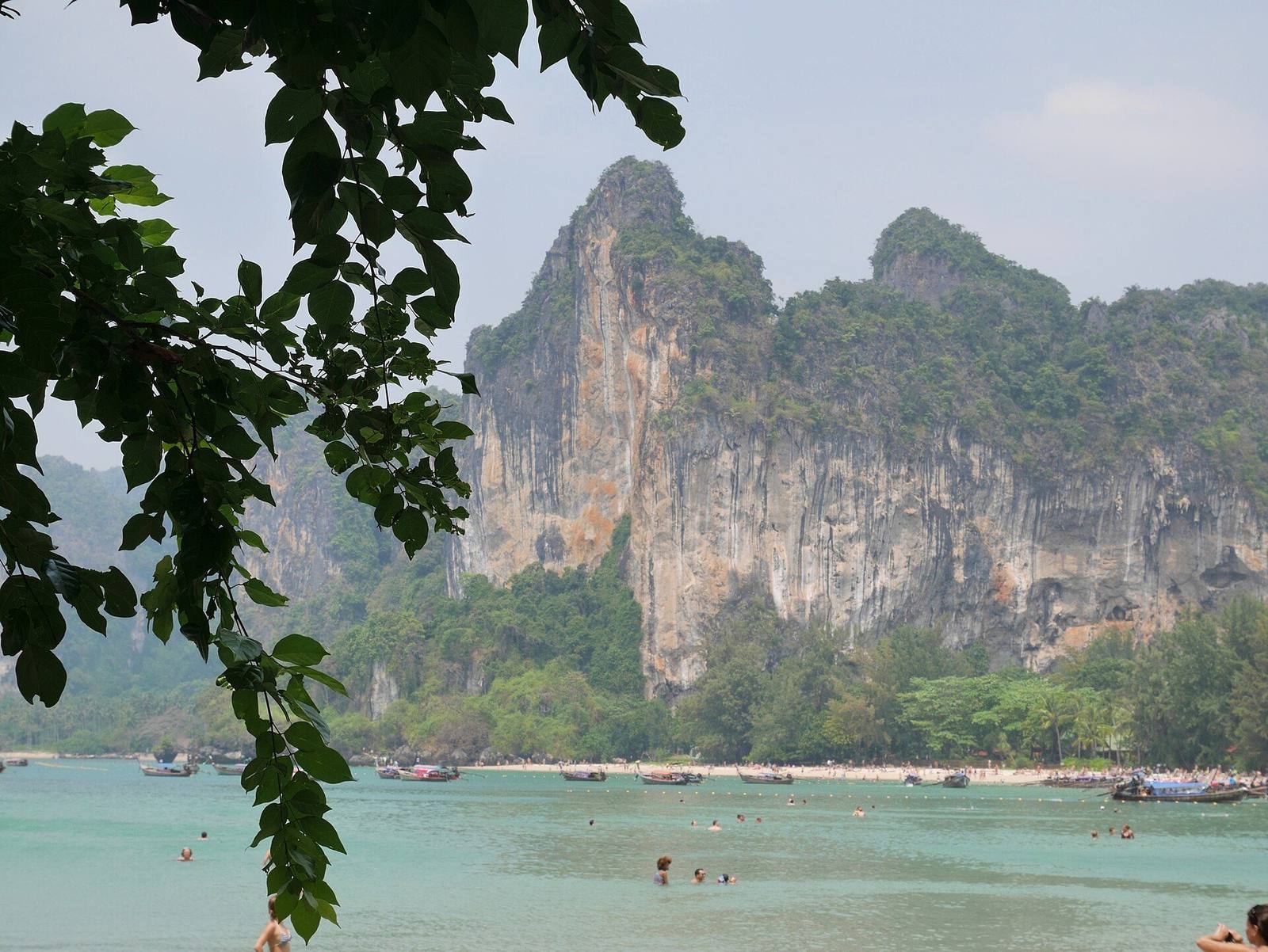 Railay West beach with limestone cliffs behind the sand