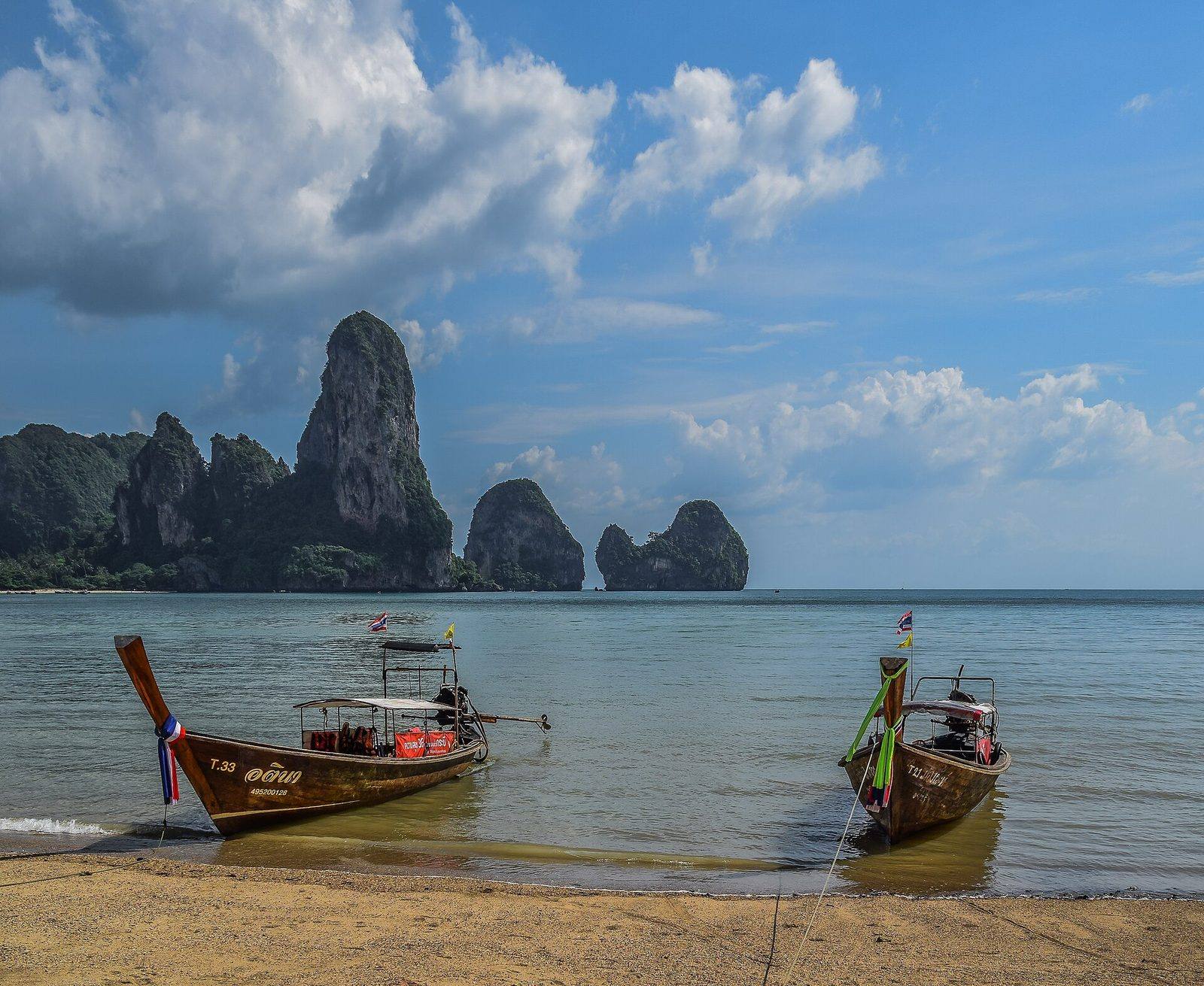 Ton Sai beach with longtail boats and limestone towers